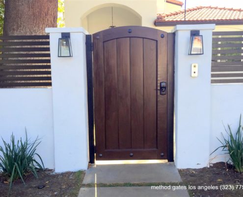 concrete fence with entrance gate