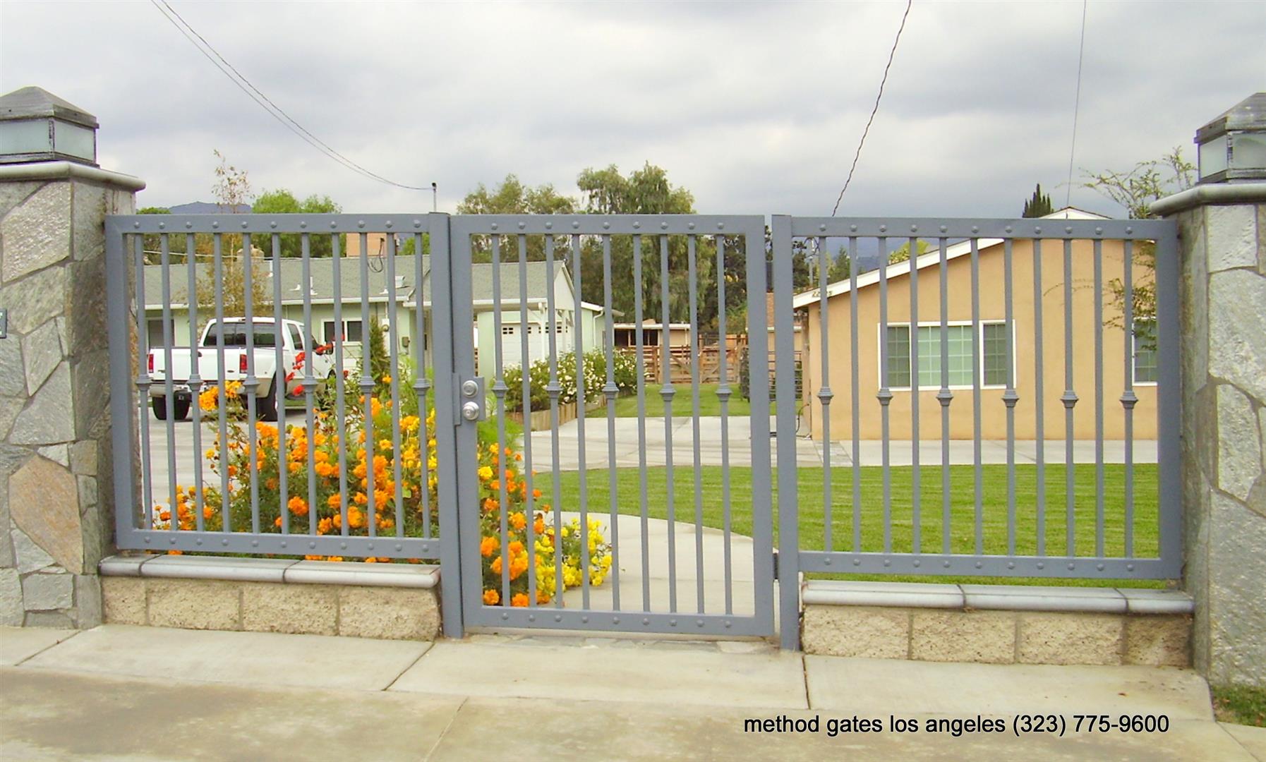 wrought iron fence with with entrance gate