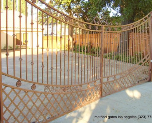 Iron Automatic Driveway Gate with fence and entrance