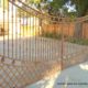 Iron Automatic Driveway Gate with fence and entrance