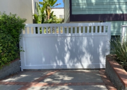 white gates near the ocean