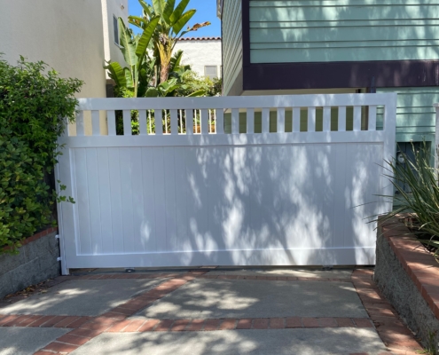 white gates near the ocean