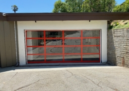 custom glass garage door with red frame