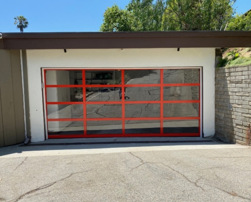 custom glass garage door with red frame